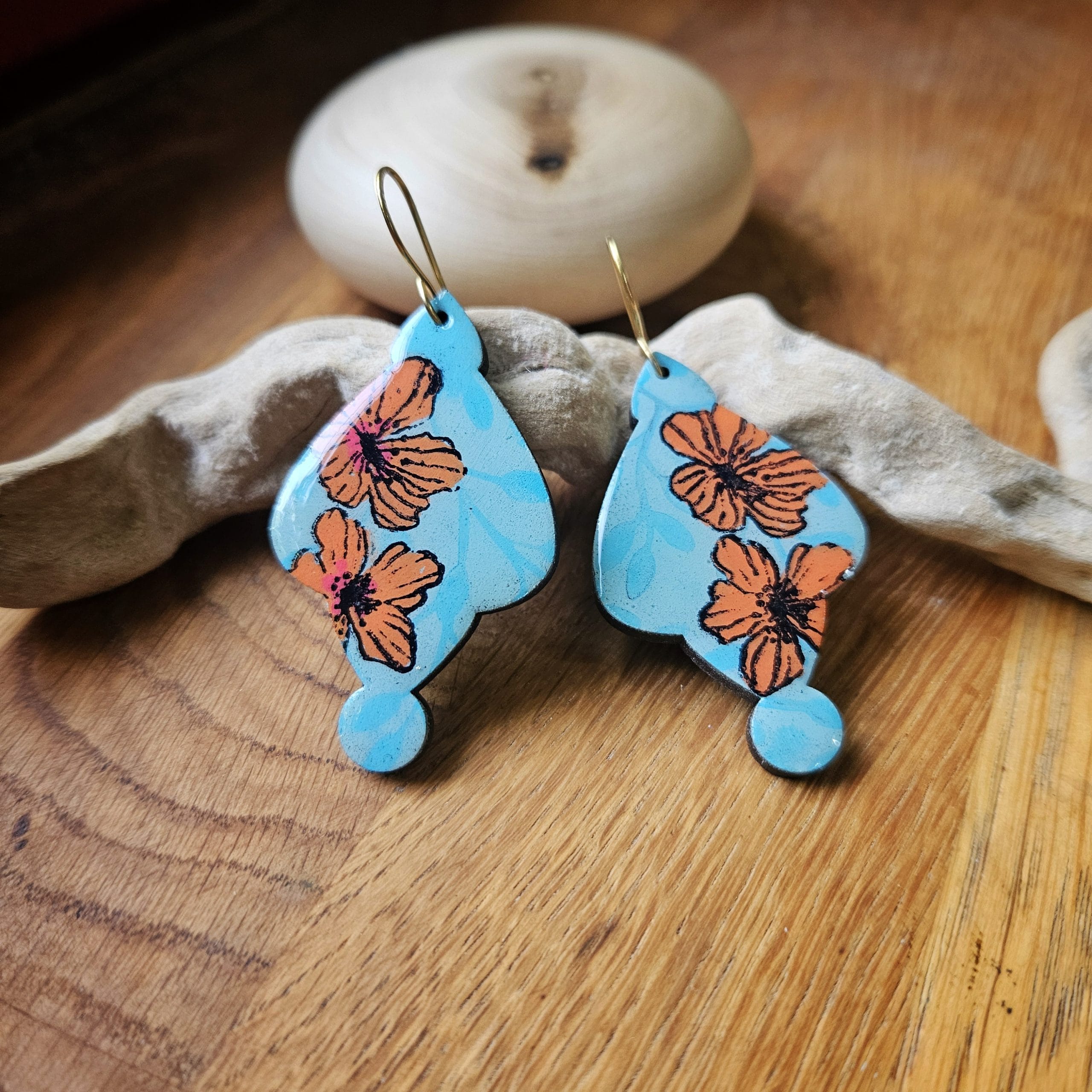 Using a special polymer clay buffer on earrings